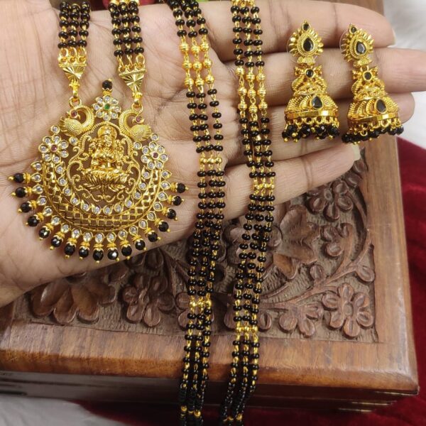 high quality Matt finished...3 lines long black beads...with lakshmi devi pendent and jhumkas
